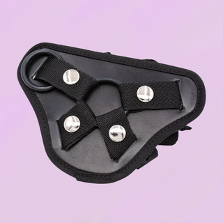 the black strap on harness shown on a purple background