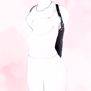 The Vesper arm shackle from a front view, it s shown on a soft pink background