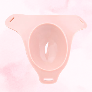 A rear view of the wearable vagina, the cup is clear to see.
