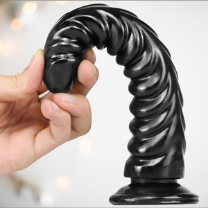 An image of the black ribbed dildo, showing just how flexible the dildo is.