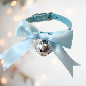 The blue soft ribbon collar bow from House Of Chastity, shown is the blue collar, matching soft satin ribbon and silver bell perfect attire for any sissy.