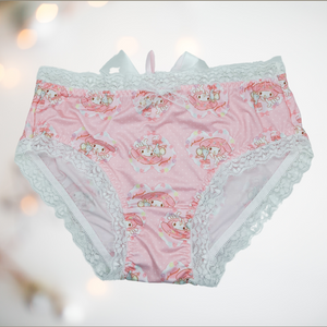 The front view of our Bunny Love panties, you can see the Japanese style bunny and mouse pattern on pink satin panties with white lace edging.