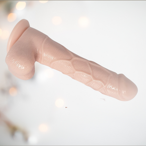 The Flesh Pink 7 Inch Dildo from House of Chastity, you can see the realistic head, veining and balls, as well as the sucker base.