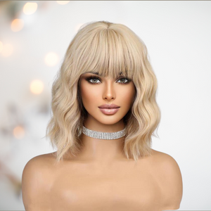The golden blonde 16" wig from House Of Chastity shown with a styled wig.