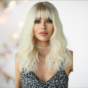 HOC9262-2 Platinum Blonde Soft Wave Long Length Hair modelled for House of Chastity. Long length platinum blonde wig, in the images the curls have been teased into soft waves and along with the long length fringe it creates a very soft look. 