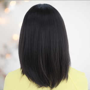 The back view of this black wig, you can see that it is slightly shaped at the back.