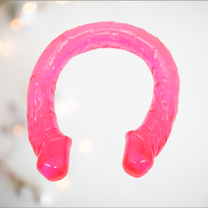 The pink double ended dildo from House of Chastity, it is very bendable and has veins running through the full length.