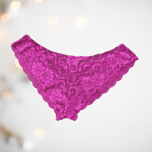 Floral lace panties from House Of Chastity. The knickers are bright pink, and are in a bikini style with penis pouch. 