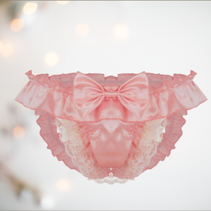 Peach satin frilly panties with a decorative bow and lace detail and roomy frontage.