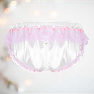 The rear view of the white satin panties from House Of Chastity. You can see how the pretty pink ribbon and lace runs throughout the panties and how far up the back the zip runs.