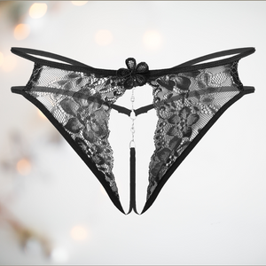 A close up of the black Open Front Floral Lace G-String from House Of Chastity, they are shown flat.
