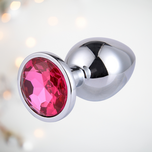 Large pink jewelled but plug, from a end view, it shows that the majority of the anal plug is made of stainless steel with just a jewelled base that will remain on view.