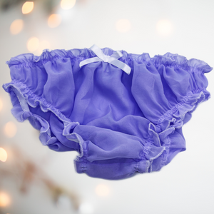 A close up of the lilac panties, the image shows the silky soft fabric and the depth of colour, these panties are see through.