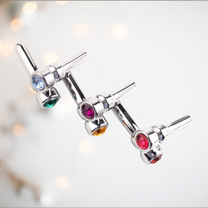 All colours of the jewelled urethral dilator. Shown is blue, green , pink, yellow, pink and red.
