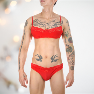 The red bandeau style bra and bikini panties modelled by a man
