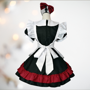 A rear view of The Stacie sissy maids dress, showing the black dress with full frilled skirt, the back of the Peter Pan style collars and the rear of the white apron.